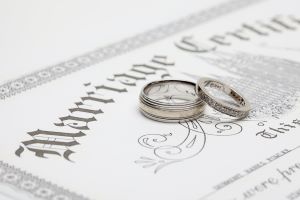 Wedding rings on marriage certificate